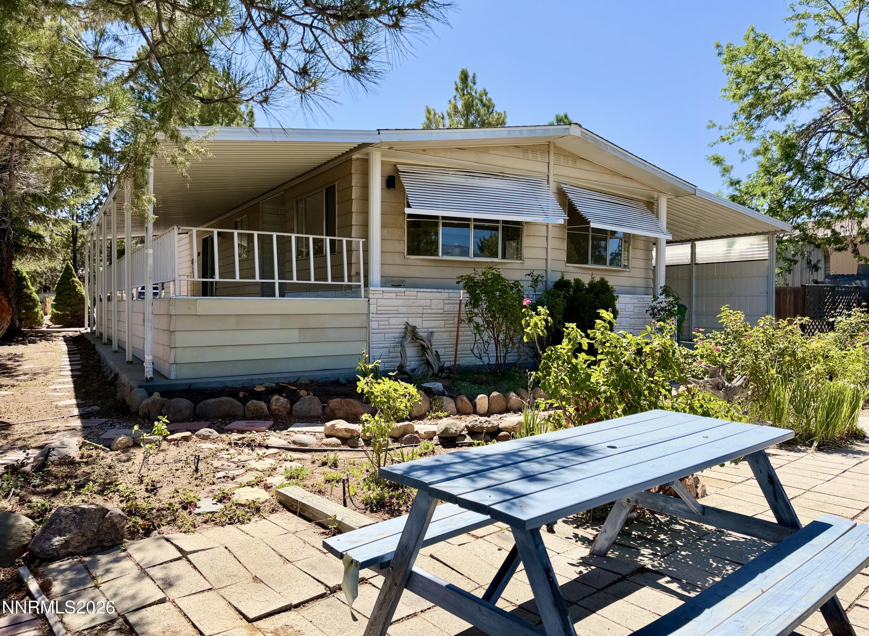 330 Taurus Circle Reno, NV 89521 - Photo 2 of 27 a view of a house with backyard and sitting area