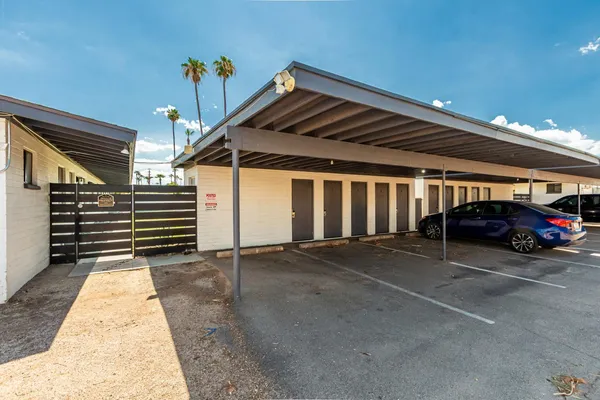 a view of garage with parked cars