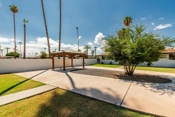 a view of a swimming pool with a yard