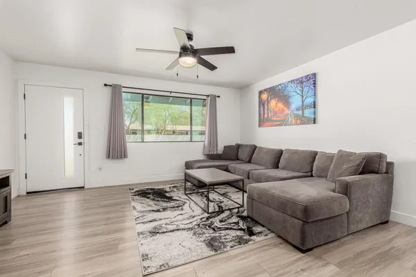a living room with furniture and a window
