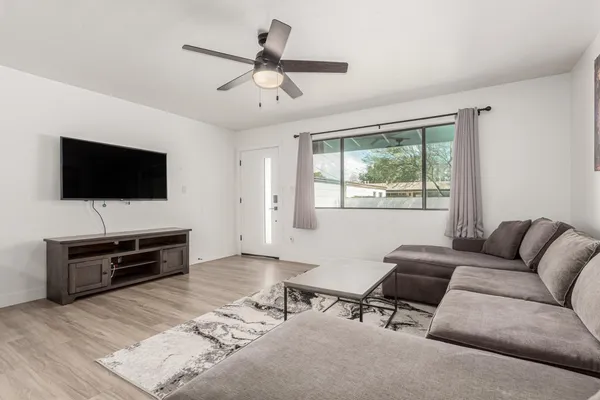 a living room with furniture and a flat screen tv