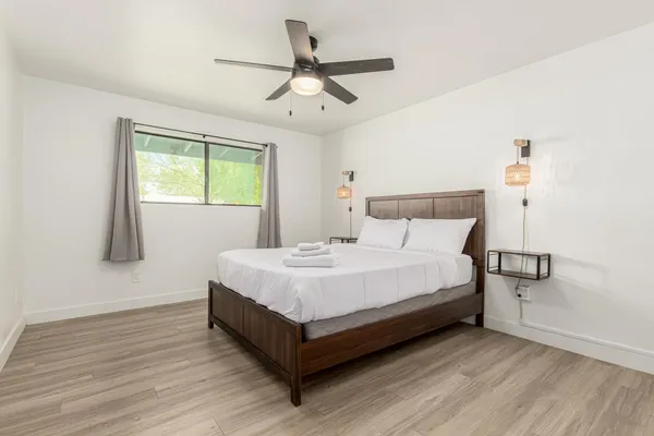 a bedroom with a bed and window