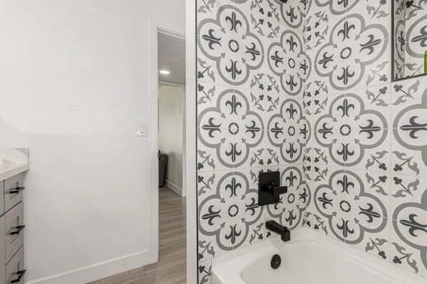 a bathroom with a shower and a curtain