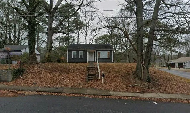 front view of a house with a yard