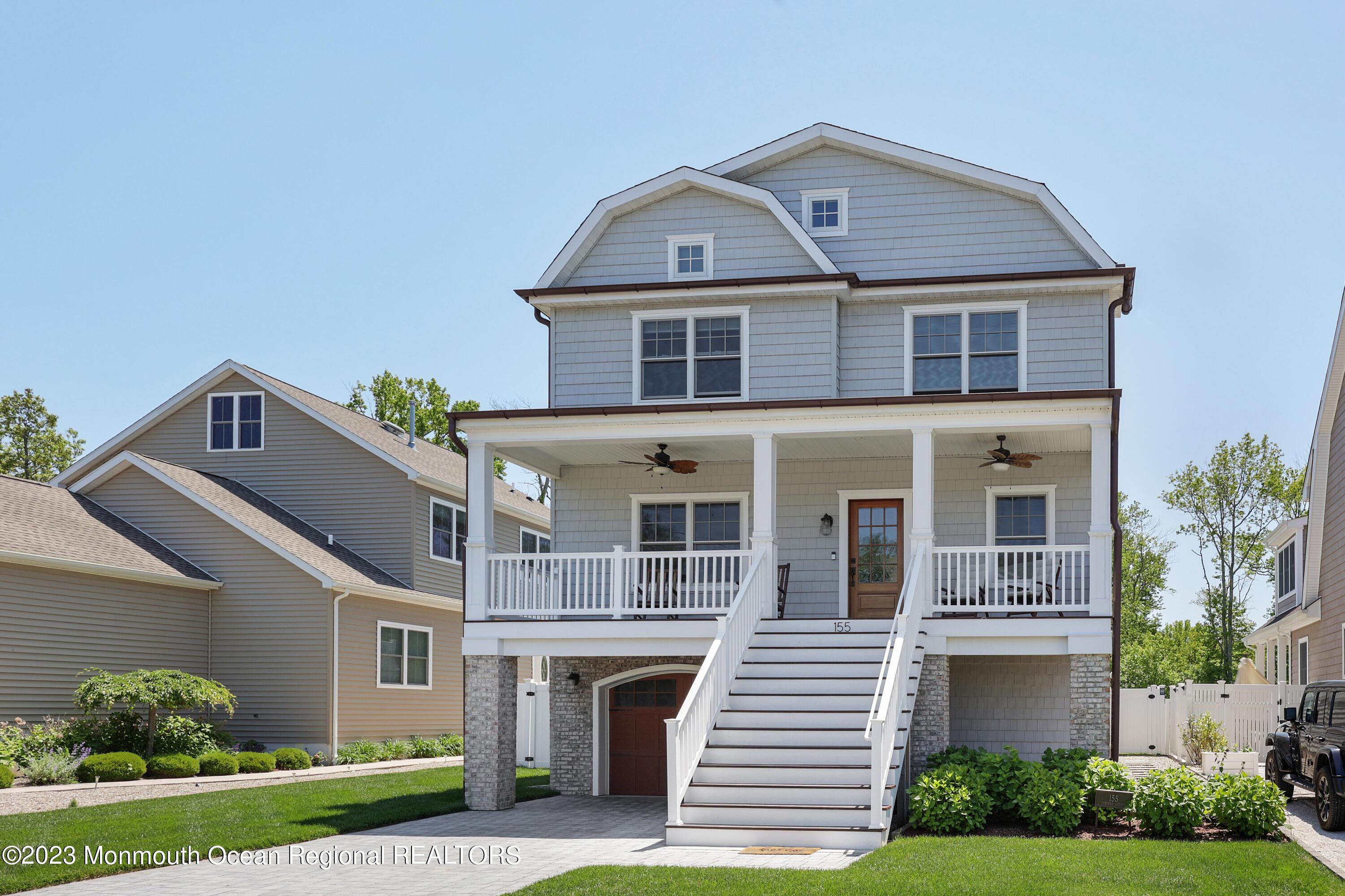 155 Osborn Avenue Bay Head, NJ 08742 - Photo 1 of 55 a front view of a house with garden
