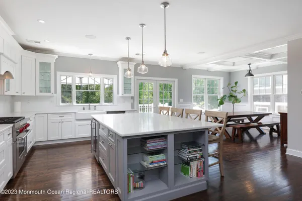 a kitchen with stainless steel appliances granite countertop a stove and kitchen island
