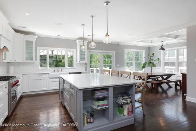 a kitchen with stainless steel appliances granite countertop a stove and kitchen island
