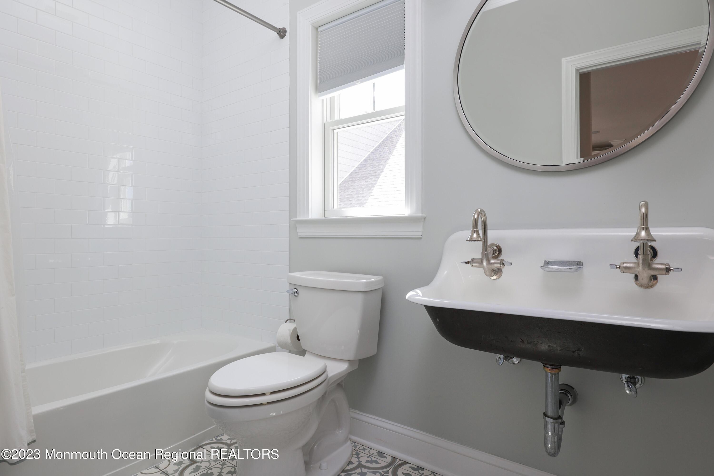 155 Osborn Avenue Bay Head, NJ 08742 - Photo 16 of 55 a bathroom with a sink toilet a mirror and tub