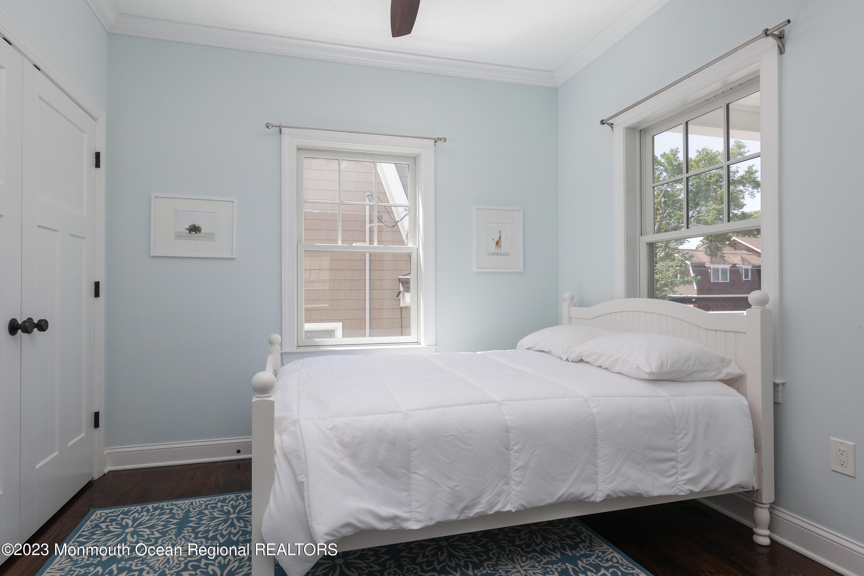 155 Osborn Avenue Bay Head, NJ 08742 - Photo 17 of 55 a bedroom with a bed and wooden floor