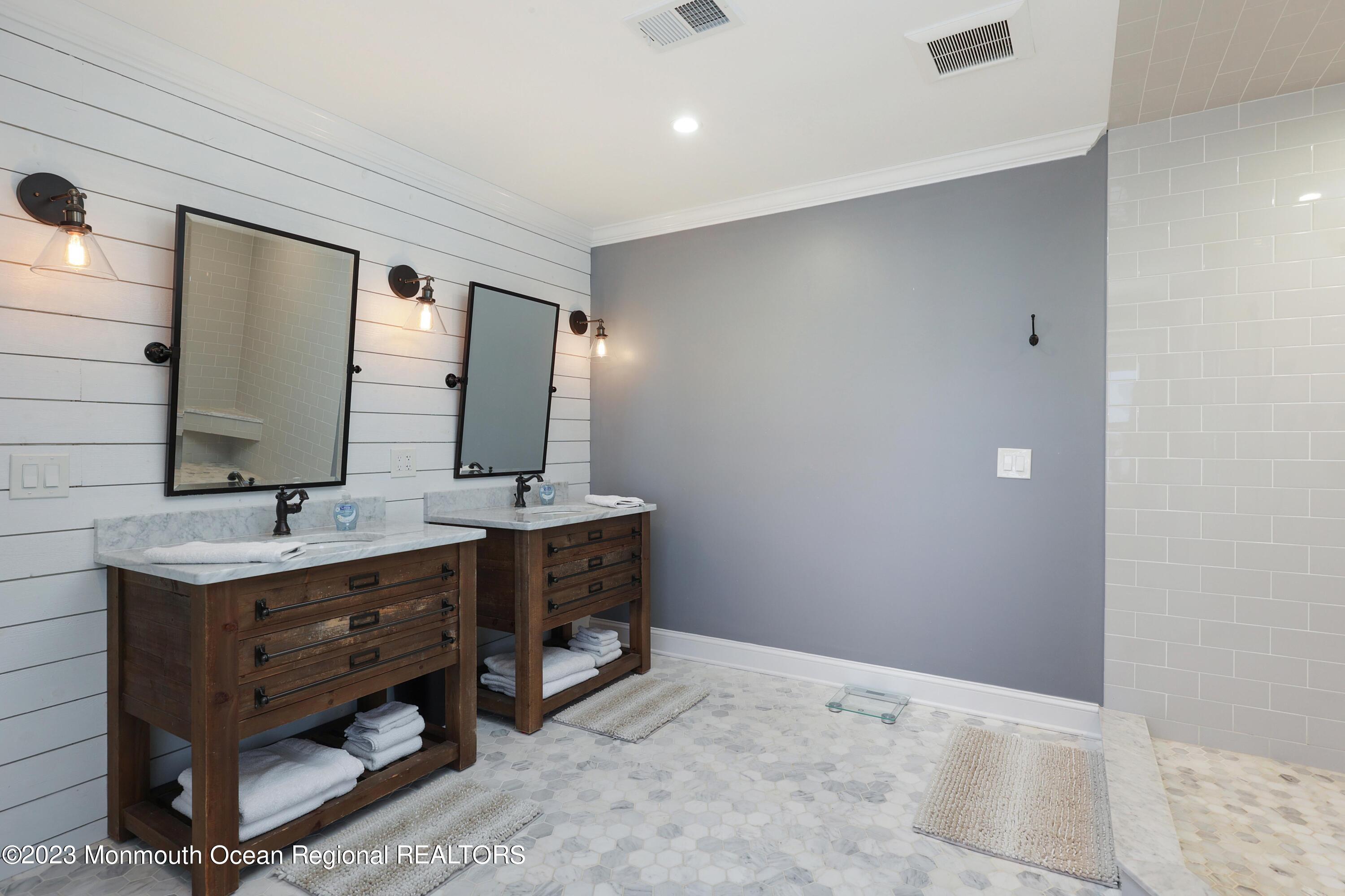 155 Osborn Avenue Bay Head, NJ 08742 - Photo 25 of 55 a bathroom with a double vanity sink and a mirror