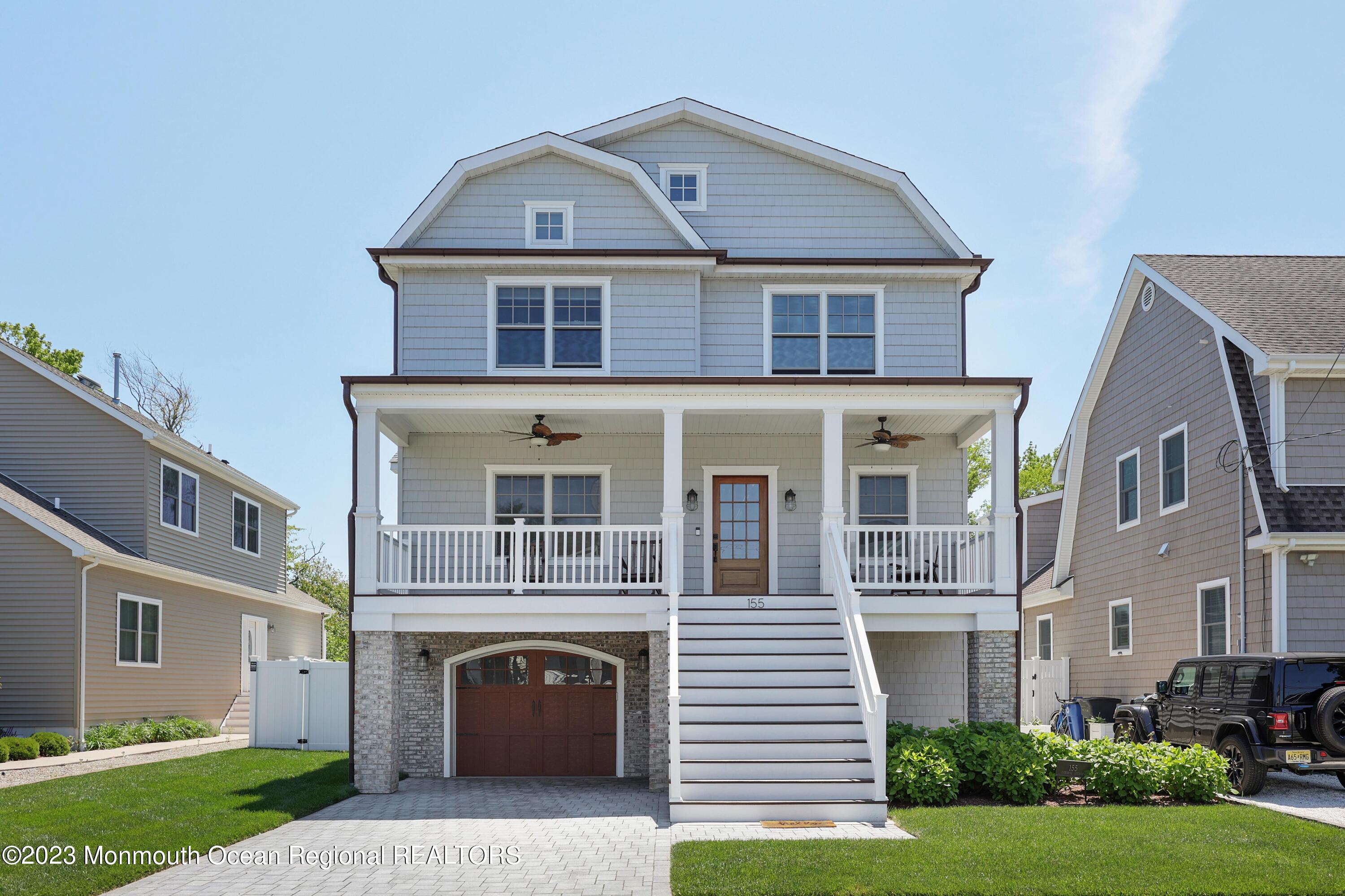 155 Osborn Avenue Bay Head, NJ 08742 - Photo 3 of 55 a front view of a house with a yard and garage