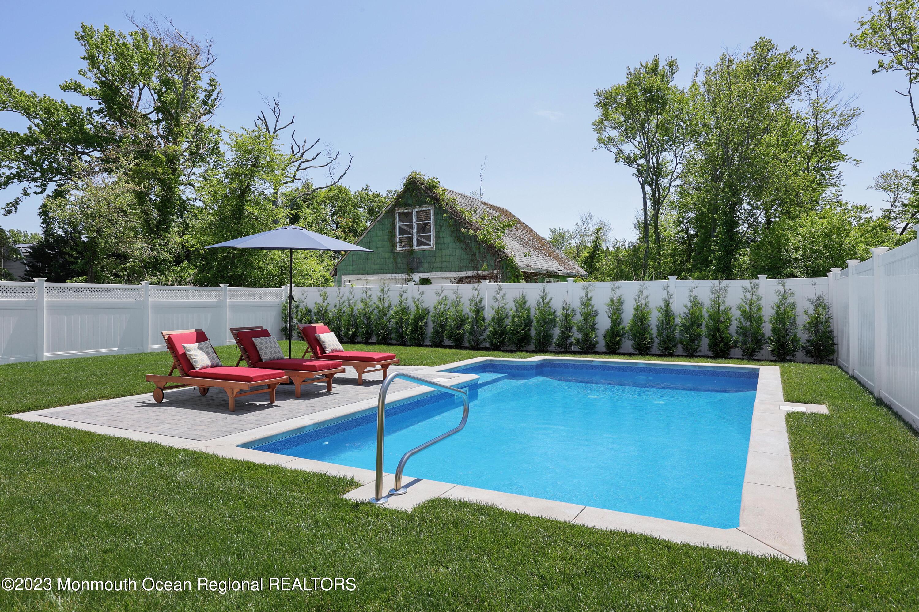 155 Osborn Avenue Bay Head, NJ 08742 - Photo 31 of 55 a backyard of a house with table and chairs
