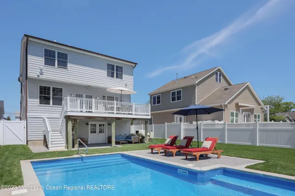 a front view of house with outdoor seating