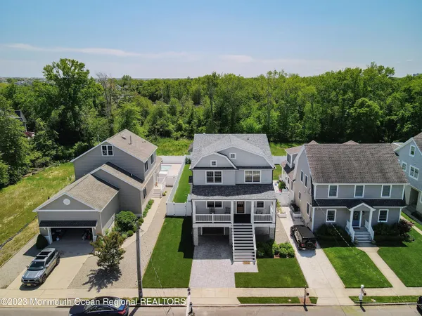 an aerial view of residential house with outdoor space and swimming pool