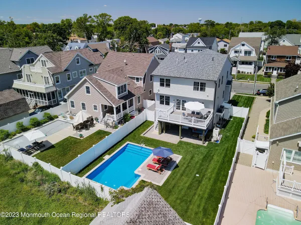 a view of an house with swimming pool garden and patio