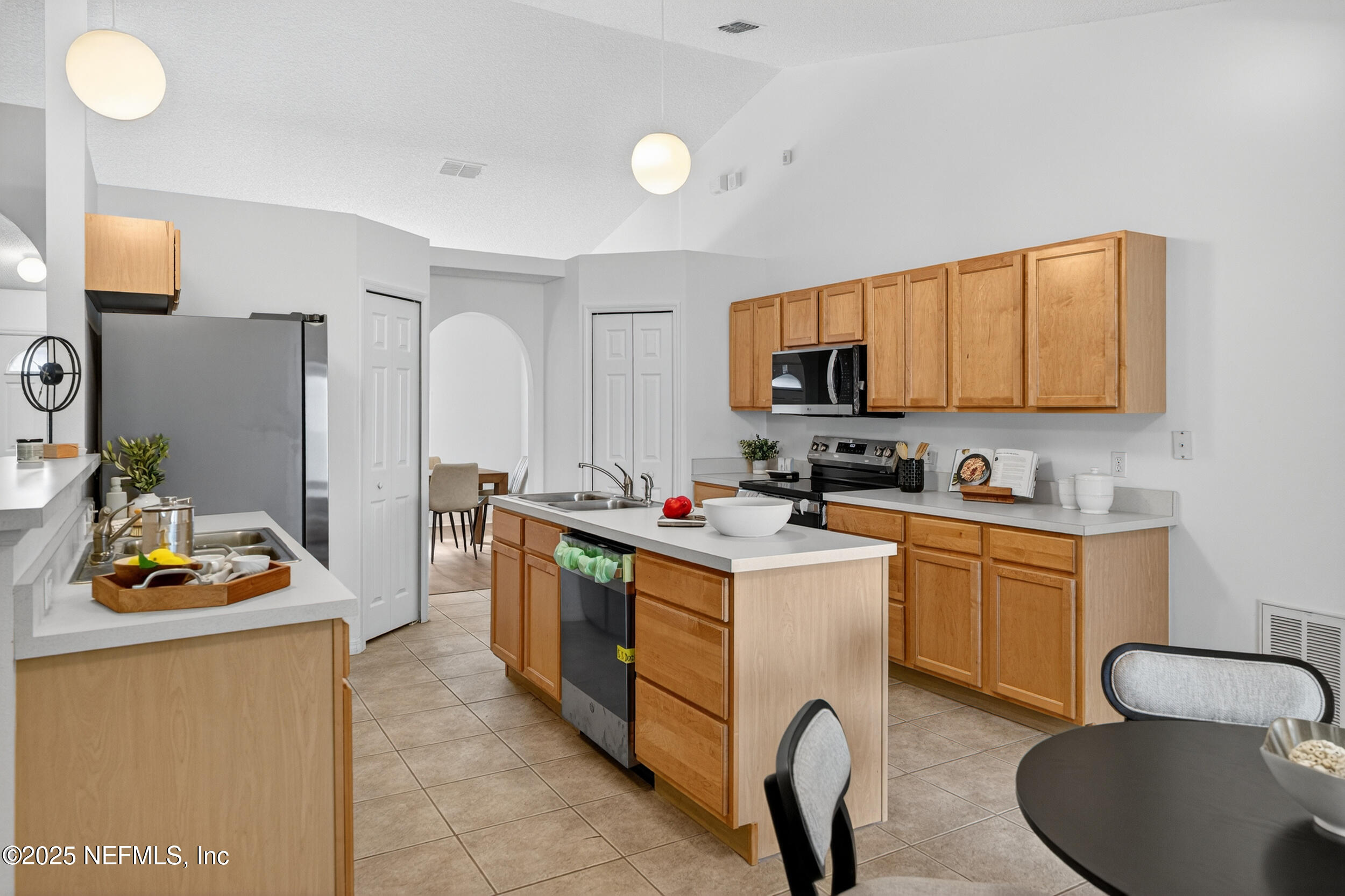 12405 Hickory Forest Road Jacksonville, FL 32226 - Photo 13 of 48 a kitchen with a sink appliances and cabinets