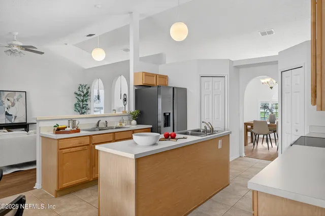 a kitchen that has a sink and cabinets
