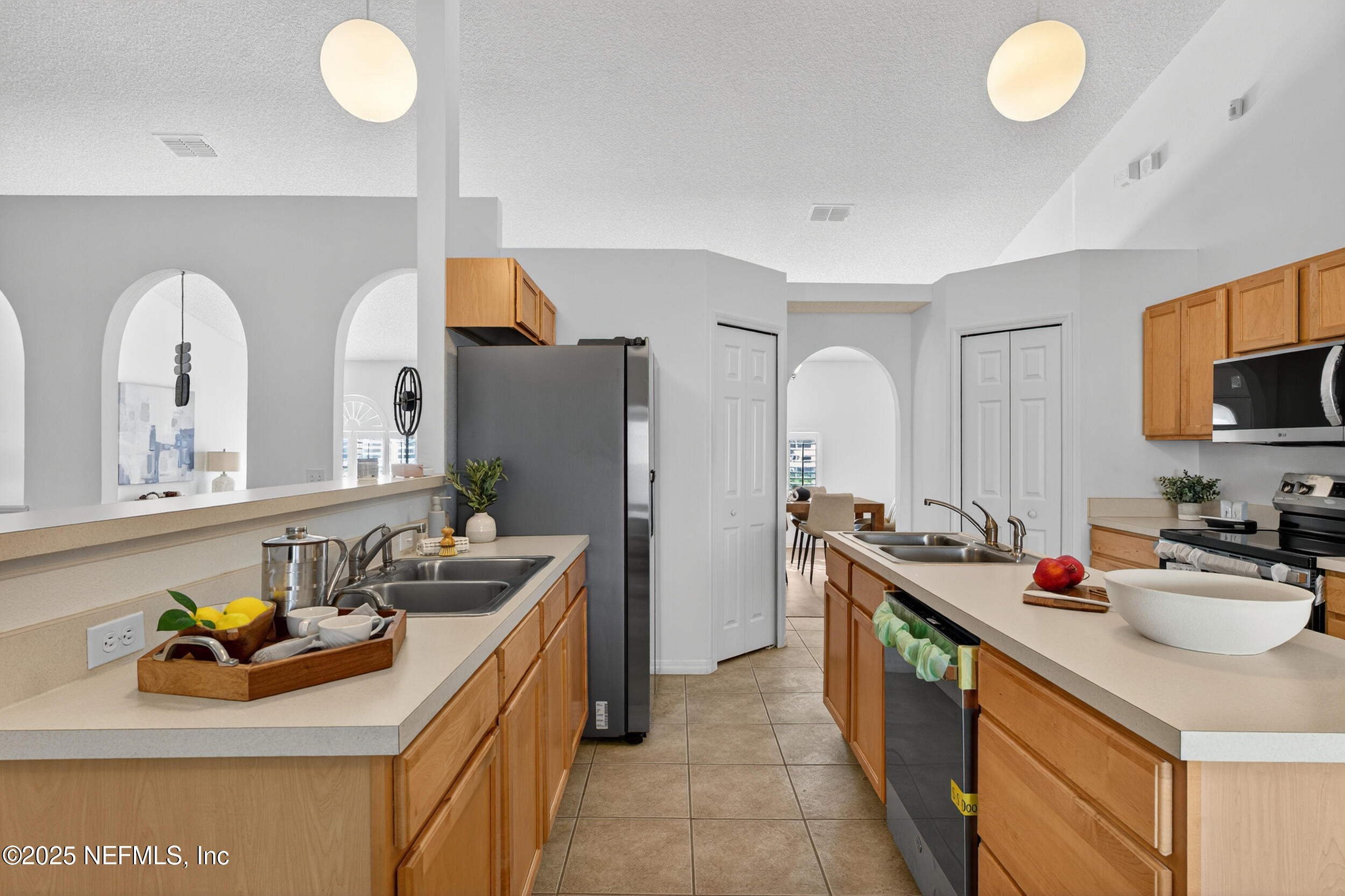 12405 Hickory Forest Road Jacksonville, FL 32226 - Photo 15 of 48 a kitchen with a sink appliances and cabinets