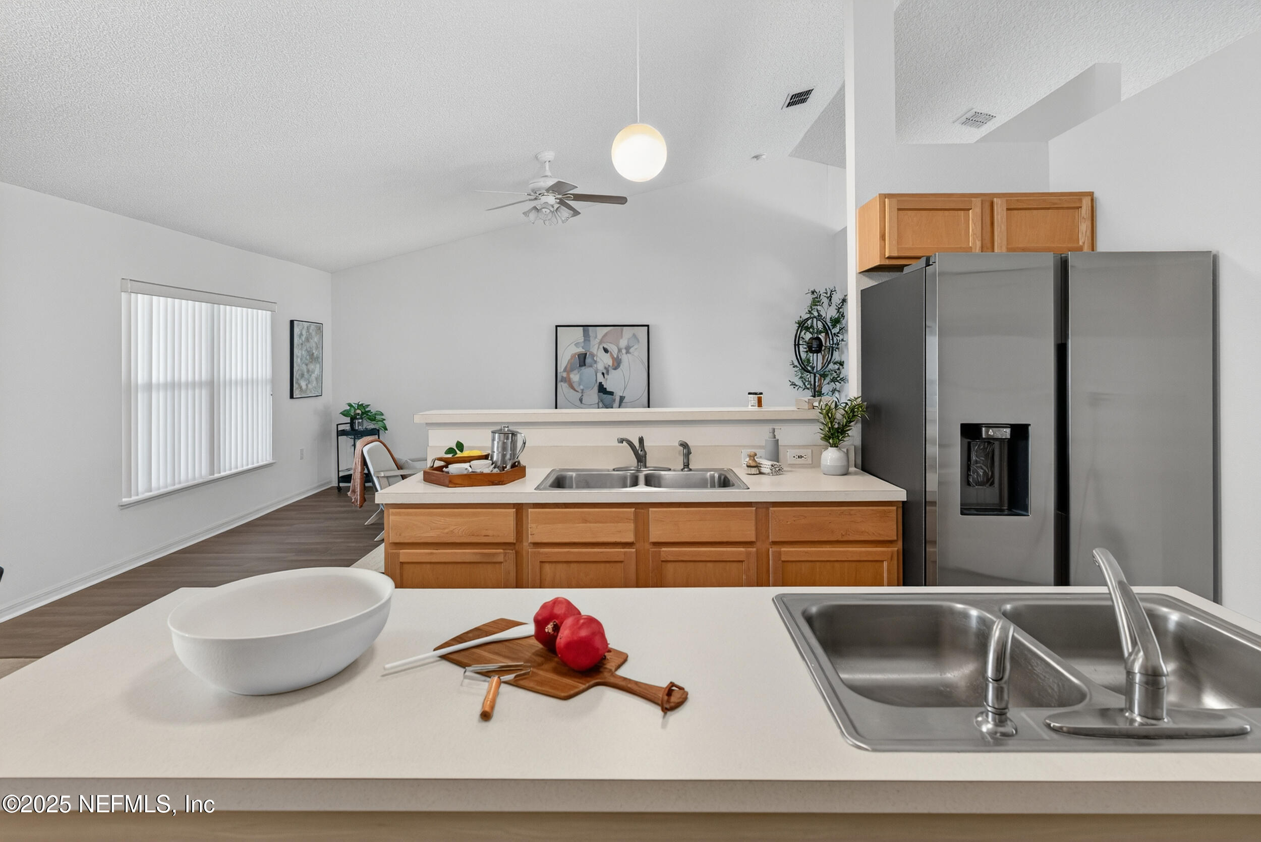12405 Hickory Forest Road Jacksonville, FL 32226 - Photo 17 of 48 a kitchen with a refrigerator and a sink