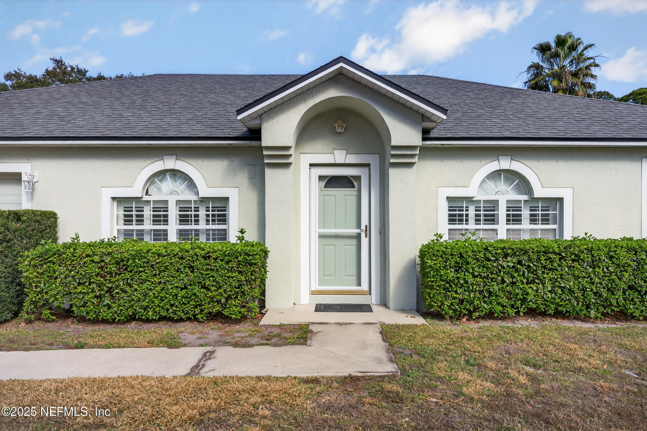 12405 Hickory Forest Road Jacksonville, FL 32226 - Photo 2 of 48 a front view of a house with a garden