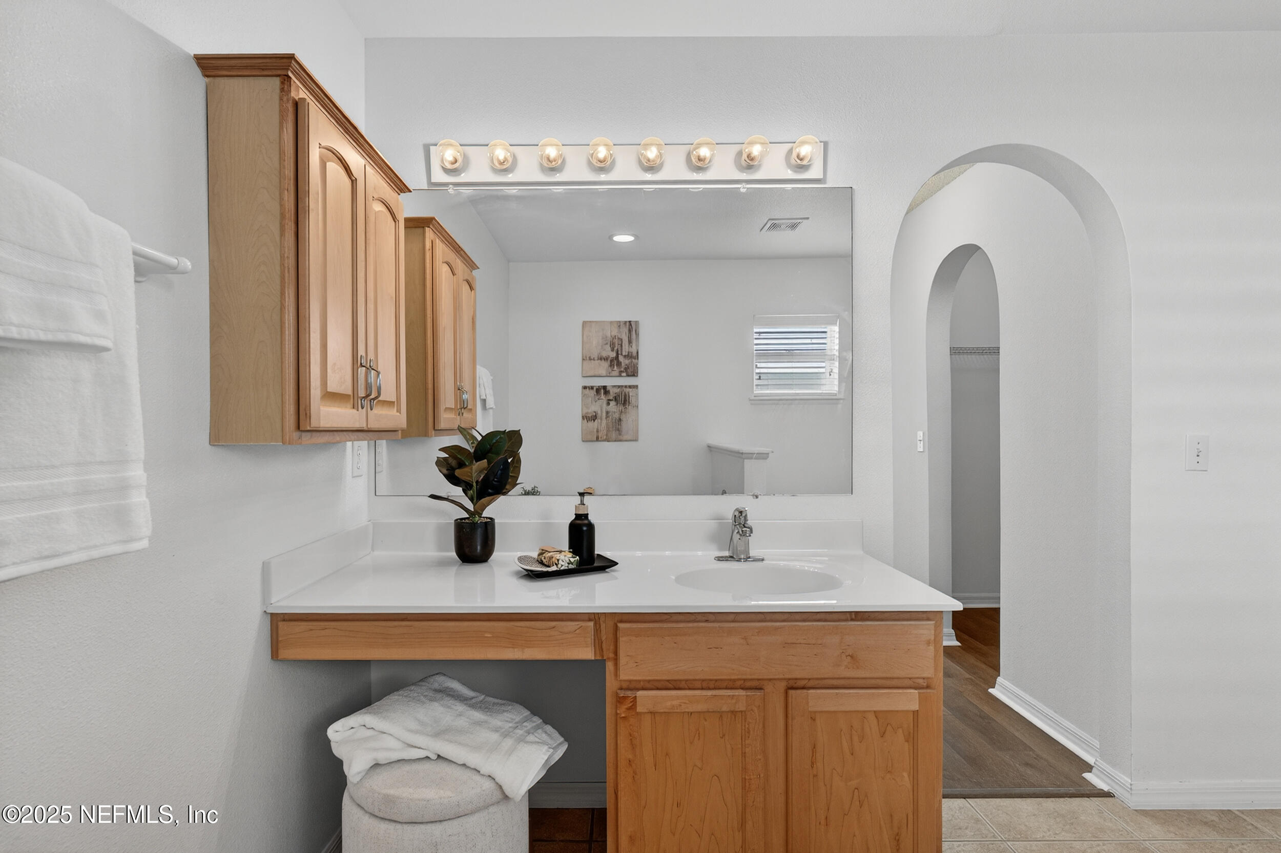 12405 Hickory Forest Road Jacksonville, FL 32226 - Photo 29 of 48 a bathroom with a sink a toilet and mirror