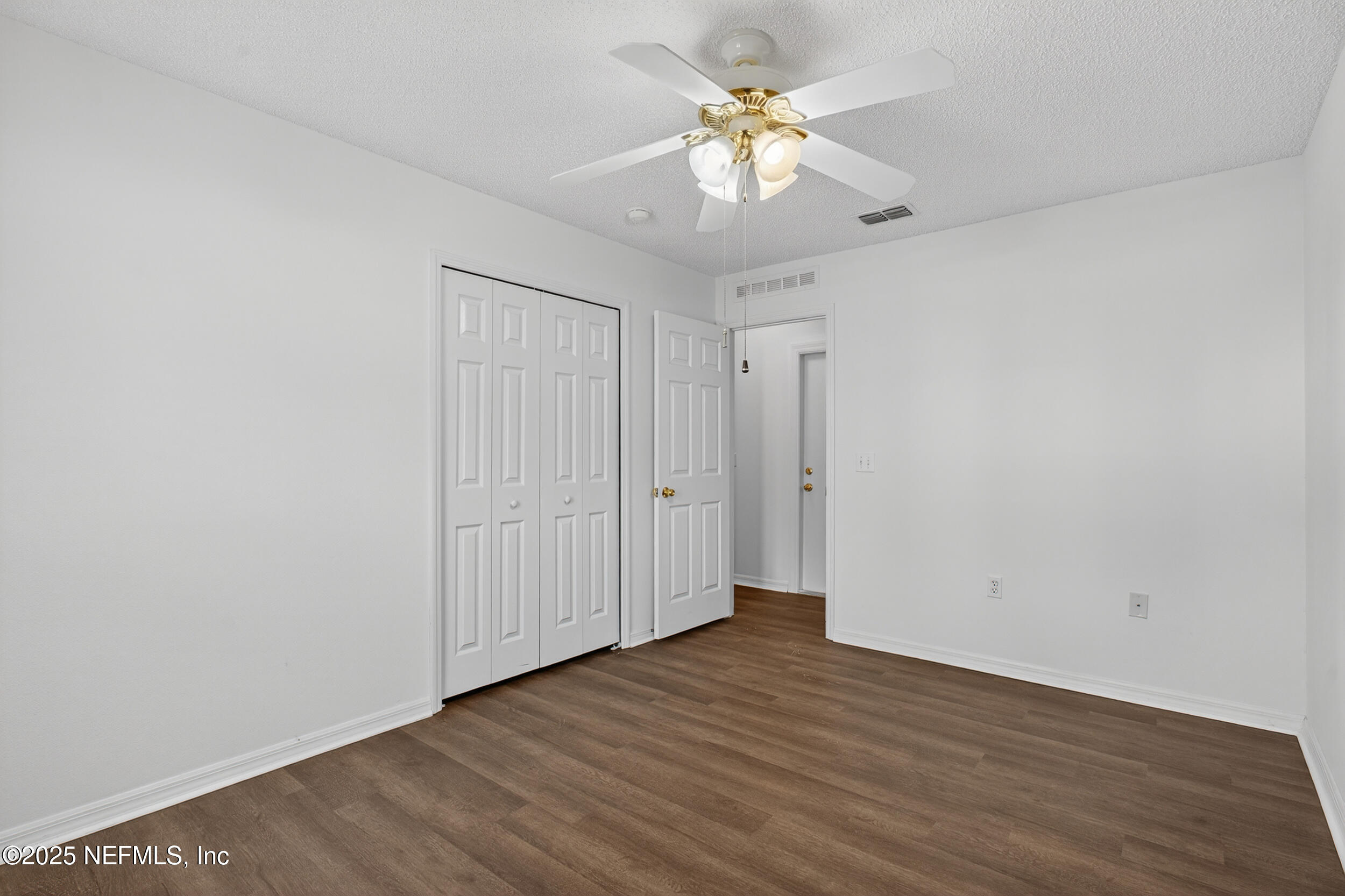 12405 Hickory Forest Road Jacksonville, FL 32226 - Photo 34 of 48 a view of an empty room with wooden floor