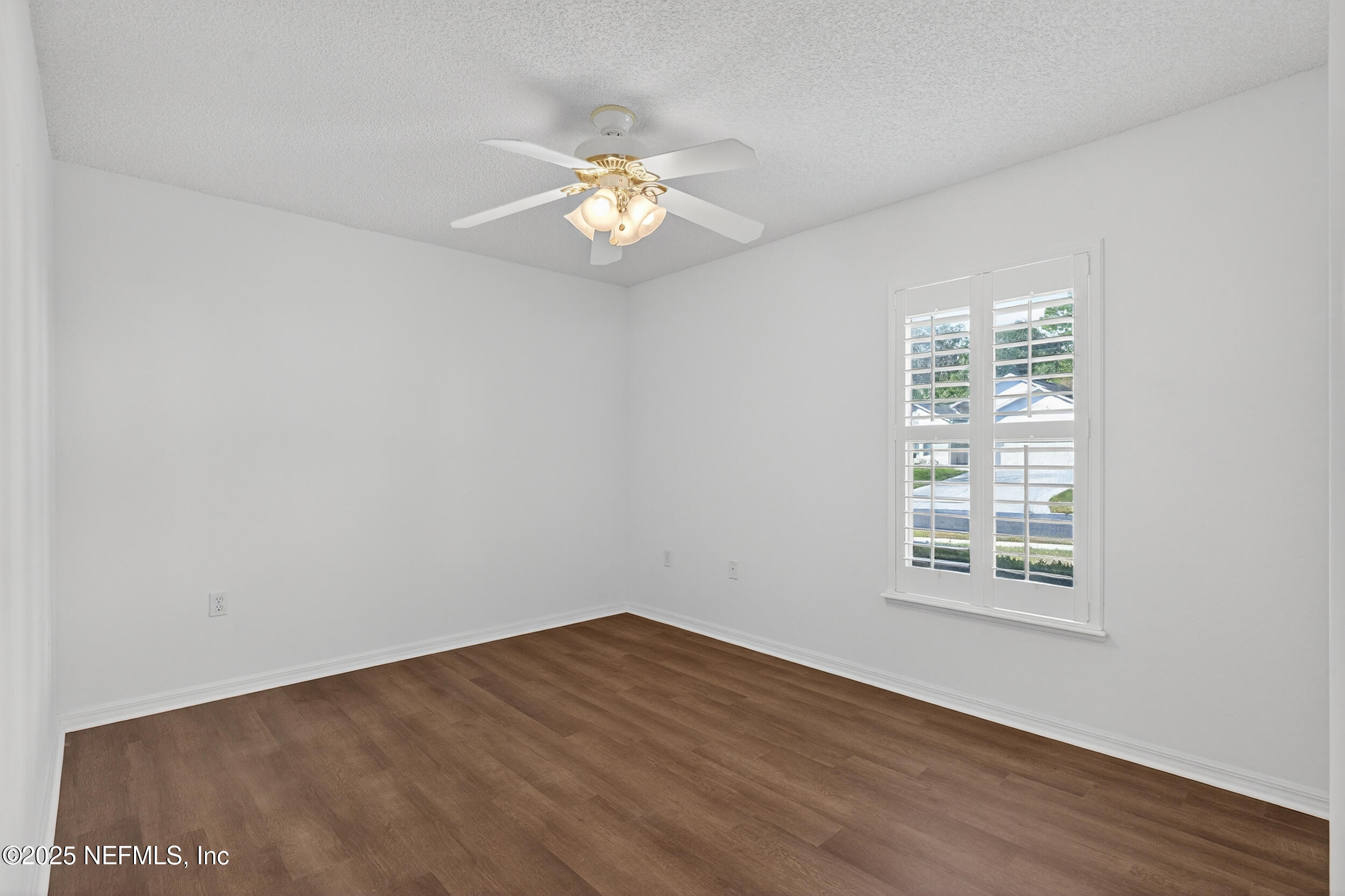 12405 Hickory Forest Road Jacksonville, FL 32226 - Photo 35 of 48 wooden floor in an empty room with a window
