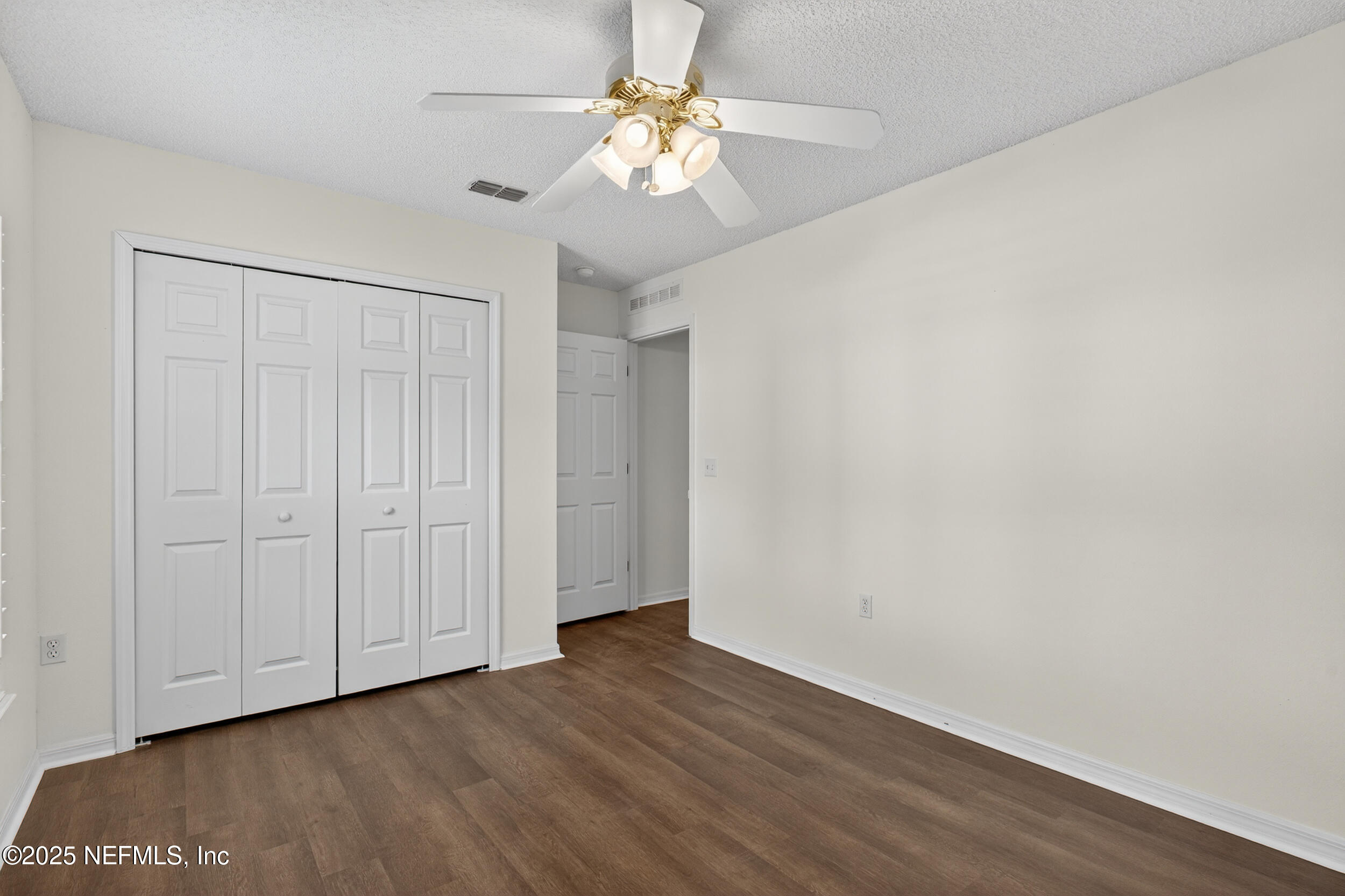 12405 Hickory Forest Road Jacksonville, FL 32226 - Photo 37 of 48 a view of an empty room with wooden floor