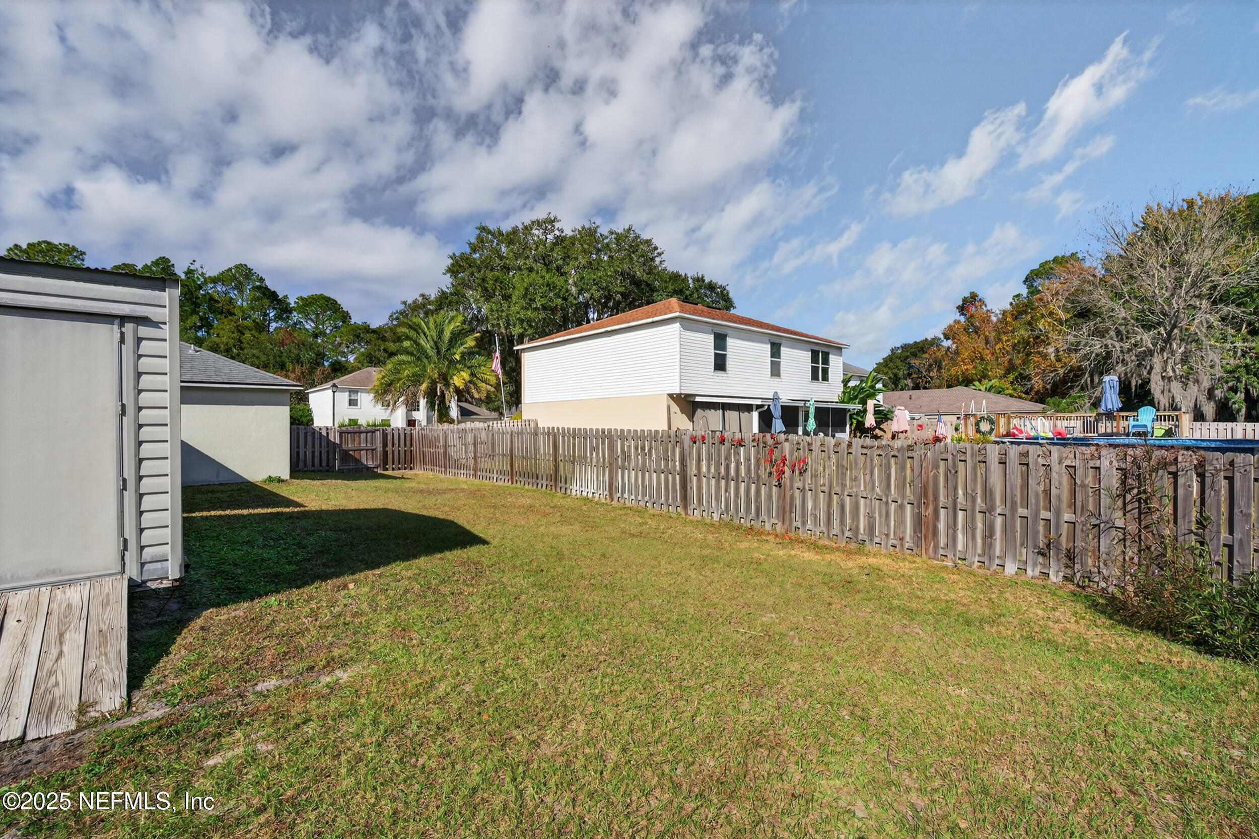 12405 Hickory Forest Road Jacksonville, FL 32226 - Photo 41 of 48 a view of a house with wooden fence next to a road