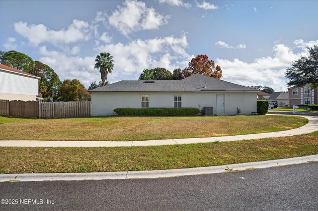 a view of house with outdoor space and yard