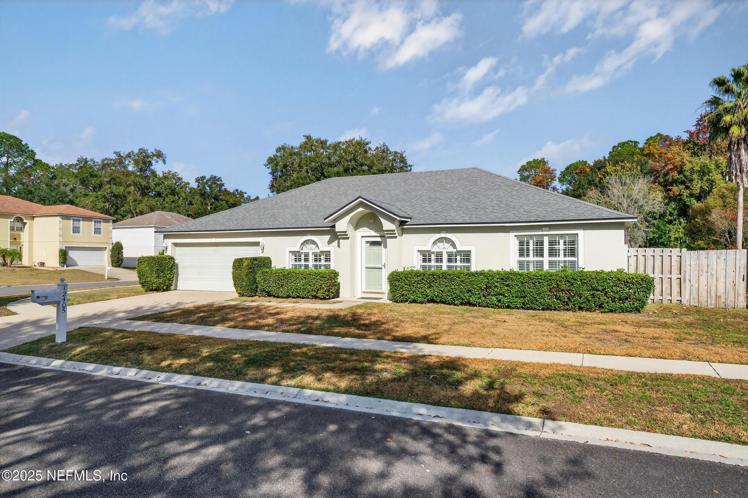 12405 Hickory Forest Road Jacksonville, FL 32226 - Photo 48 of 48 a front view of a house with a yard and garage
