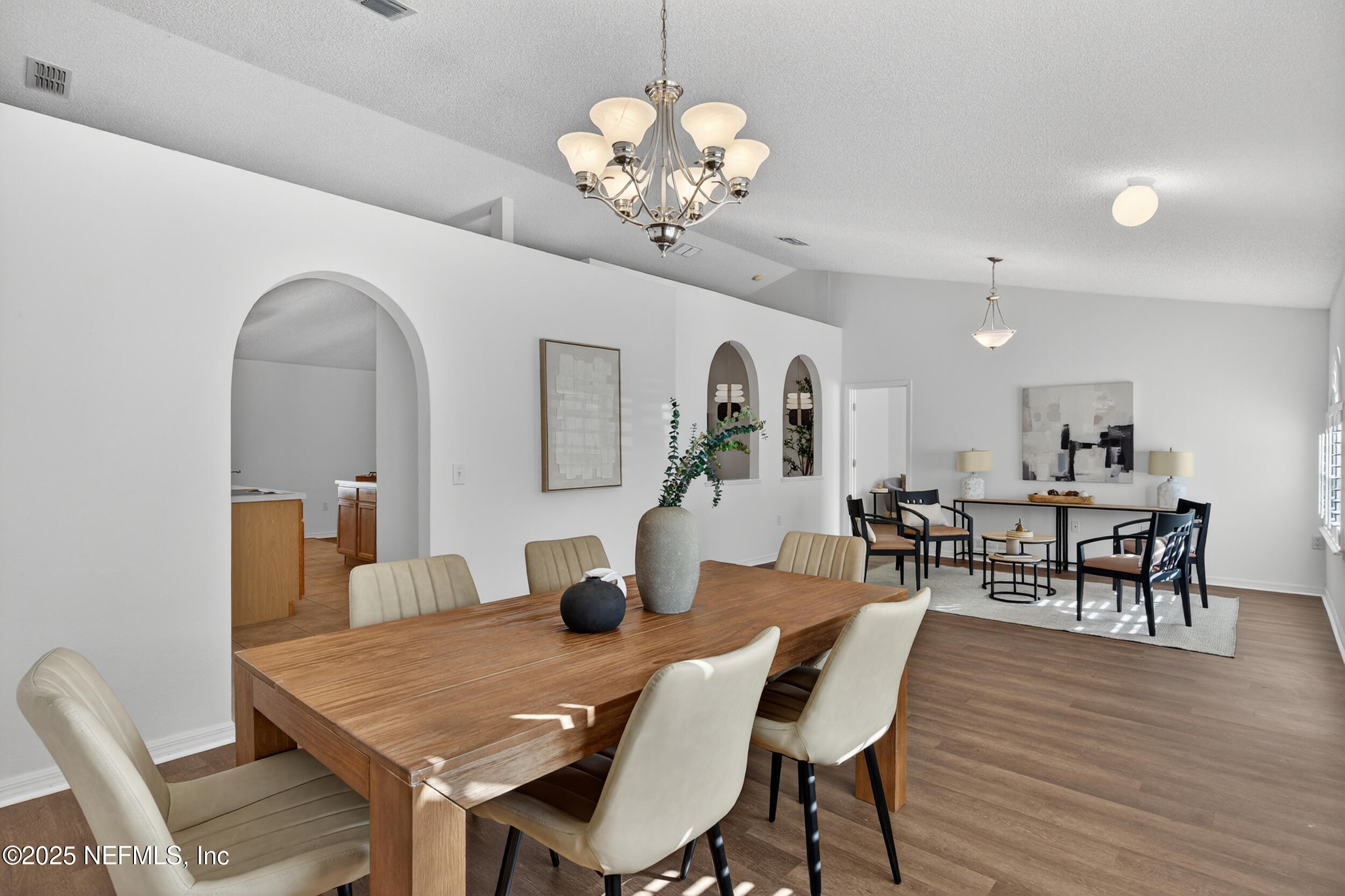12405 Hickory Forest Road Jacksonville, FL 32226 - Photo 5 of 48 a view of a dining room with furniture and wooden floor