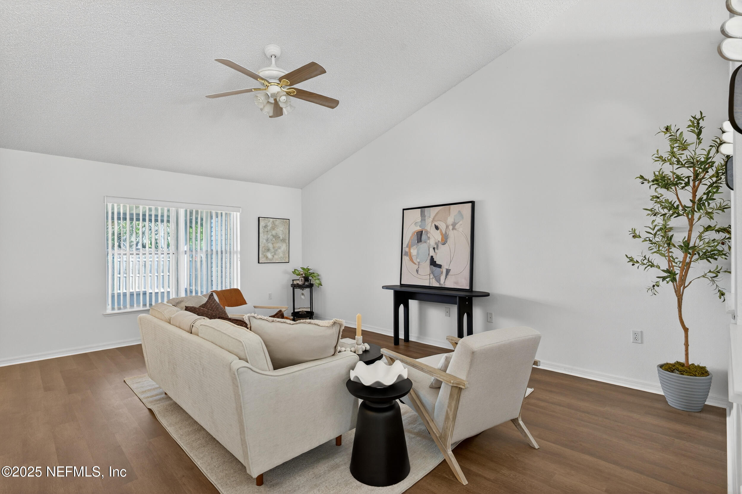 12405 Hickory Forest Road Jacksonville, FL 32226 - Photo 10 of 48 a living room with furniture and a potted plant