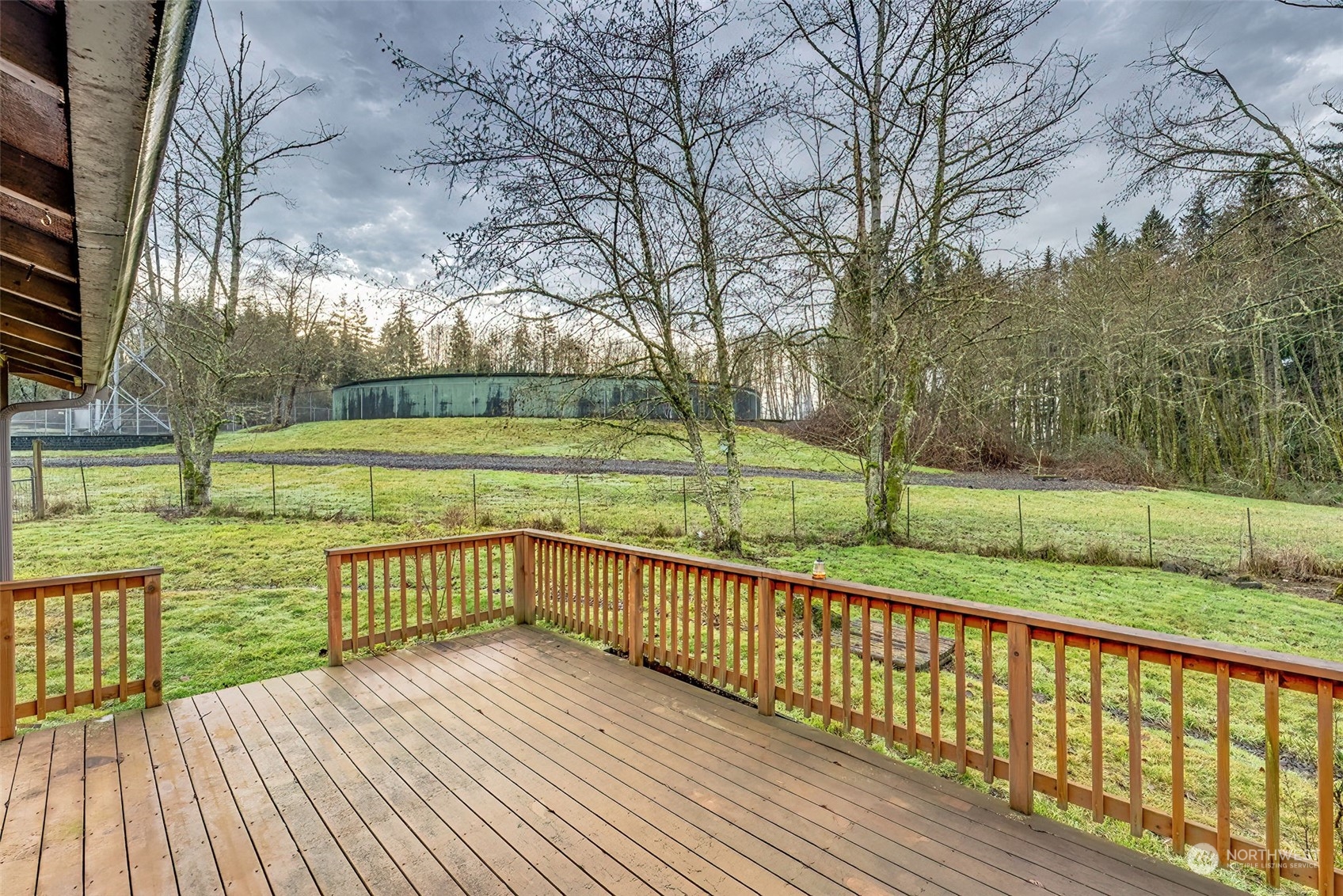 137 Ridgecrest Drive Longview, WA 98632 - Photo 37 of 40 a view of deck with wooden floor and fence next to a yard