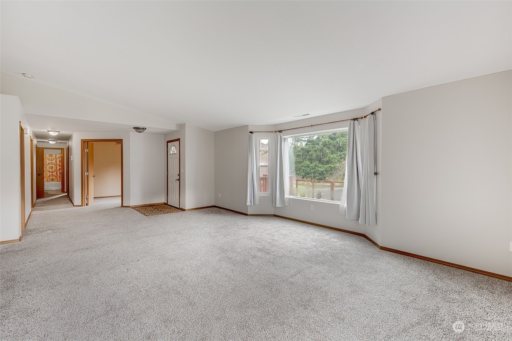 137 Ridgecrest Drive Longview, WA 98632 - Photo 8 of 40 a view of a big room with windows and chandelier fan