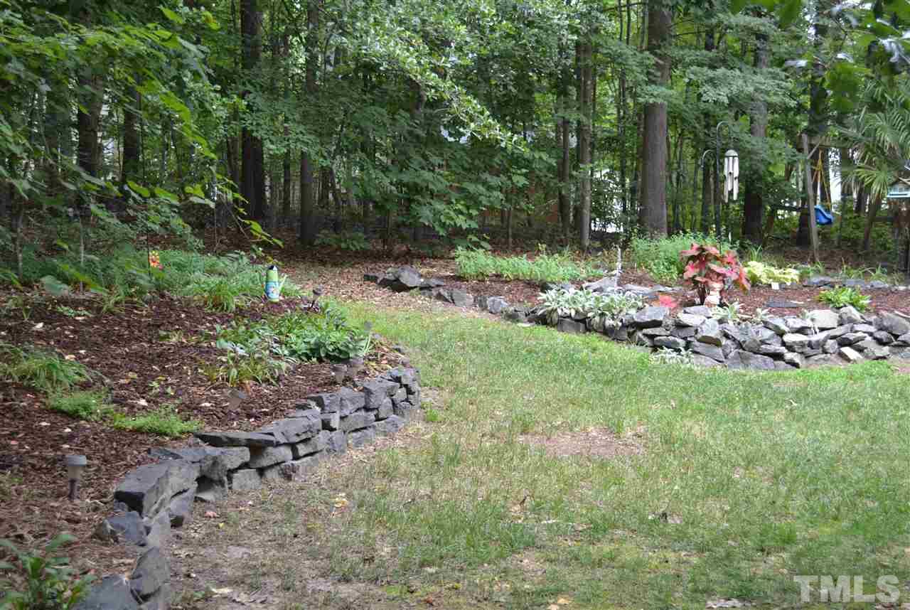 112 Clay Ridge Way Holly Springs, NC 27540 - Photo 22 of 25 Open space ideal for garden.
