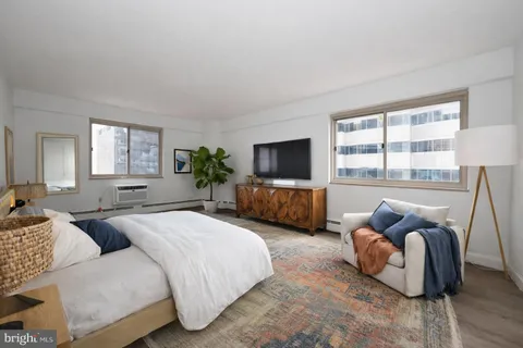 a kitchen with stainless steel appliances granite countertop a sink a stove and cabinets