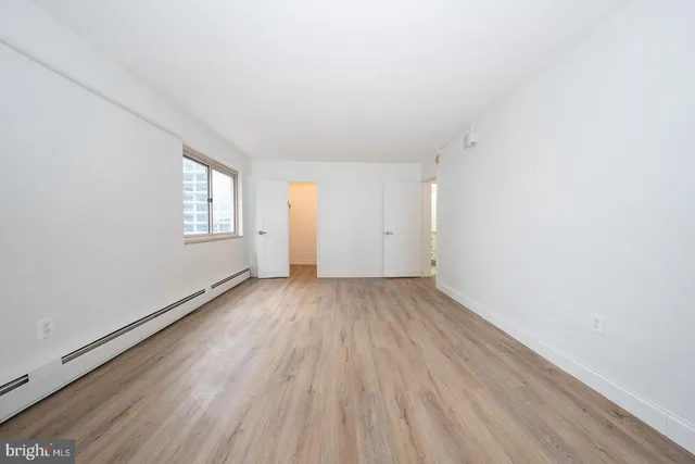 a view of a hallway with washer and dryer