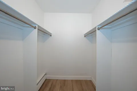 a bedroom with bed and window