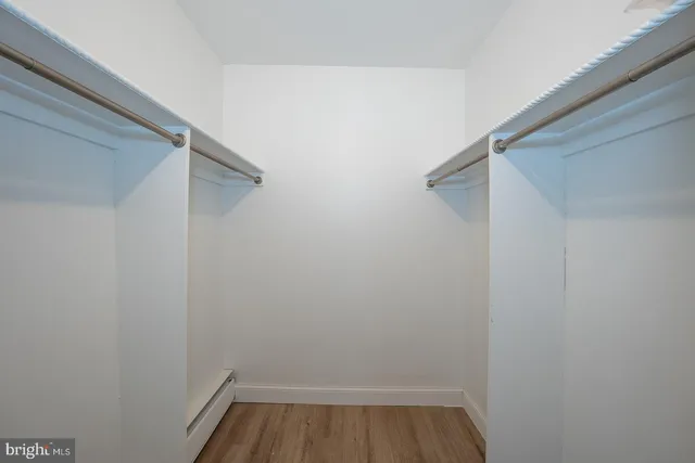 a bedroom with bed and window