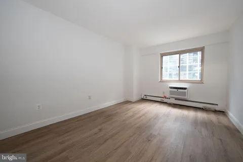 a bathroom with a sink toilet a mirror and shower