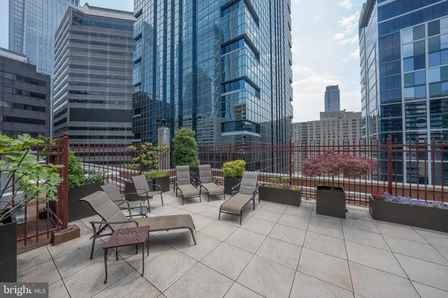 a backyard of a house with outdoor seating