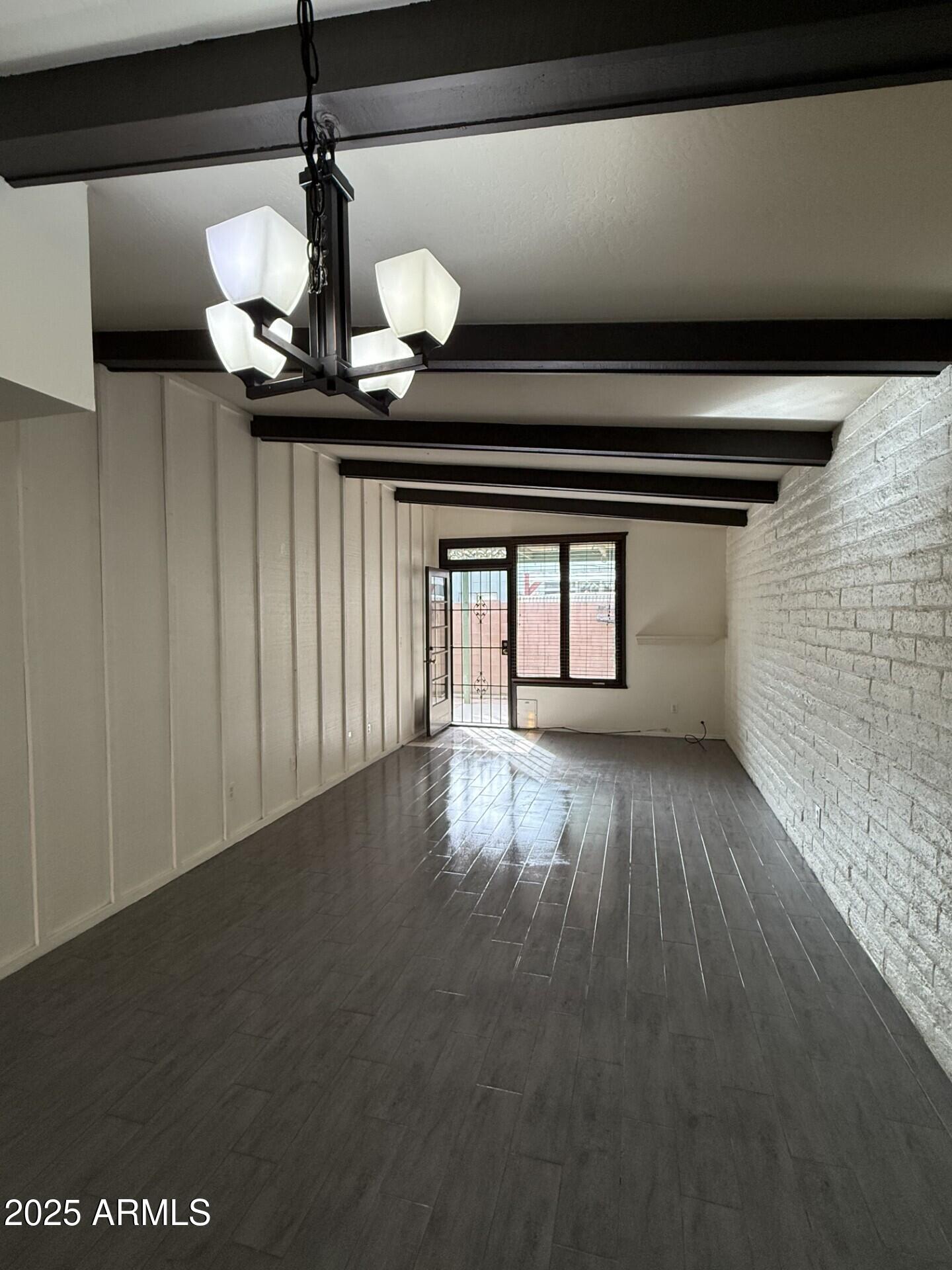4414 East Hubbell Street, Unit 69 Phoenix, AZ 85008 - Photo 8 of 10 a view of wooden floor and window in a room