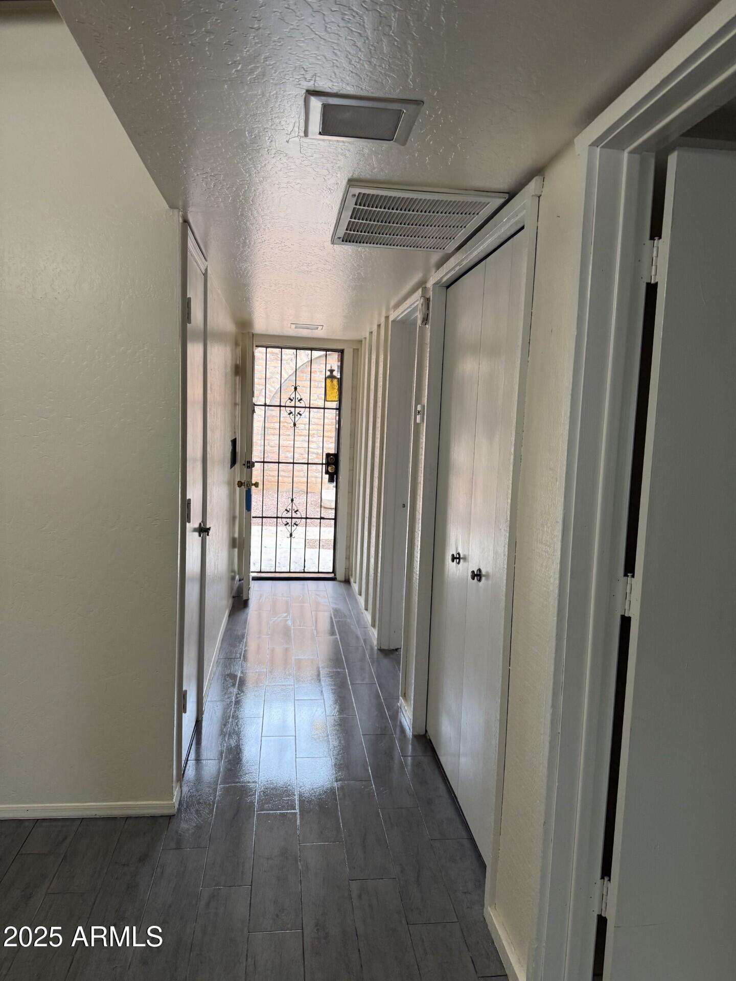 4414 East Hubbell Street, Unit 69 Phoenix, AZ 85008 - Photo 9 of 10 a view of hallway with wooden floor