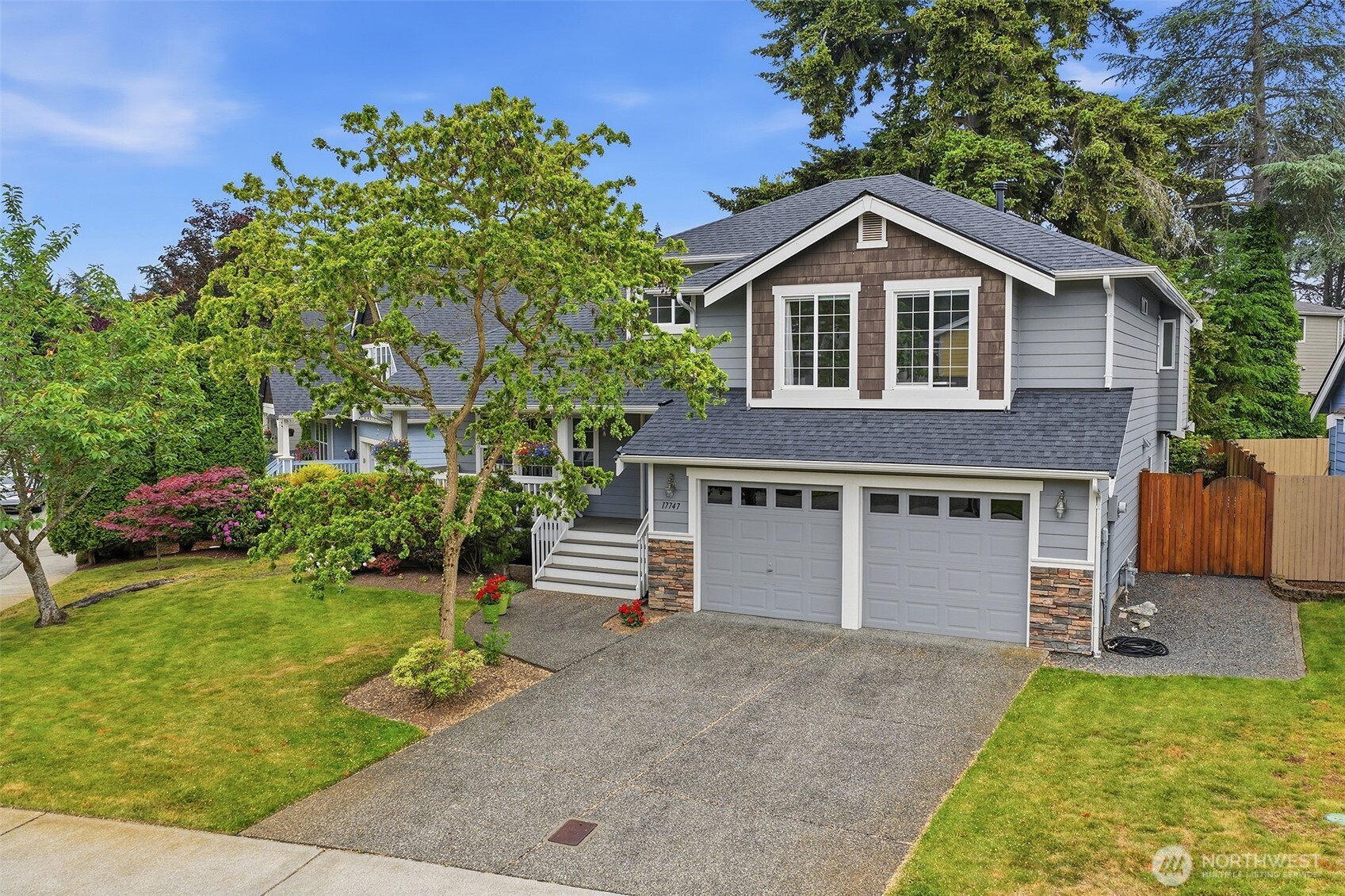17747 89th Court Northeast Bothell, WA 98011 - Photo 1 of 33 a house view with a garden space