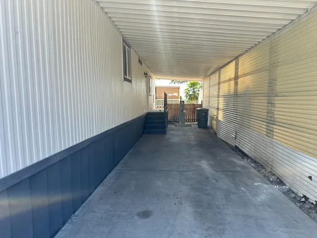 a view of a balcony with car parked