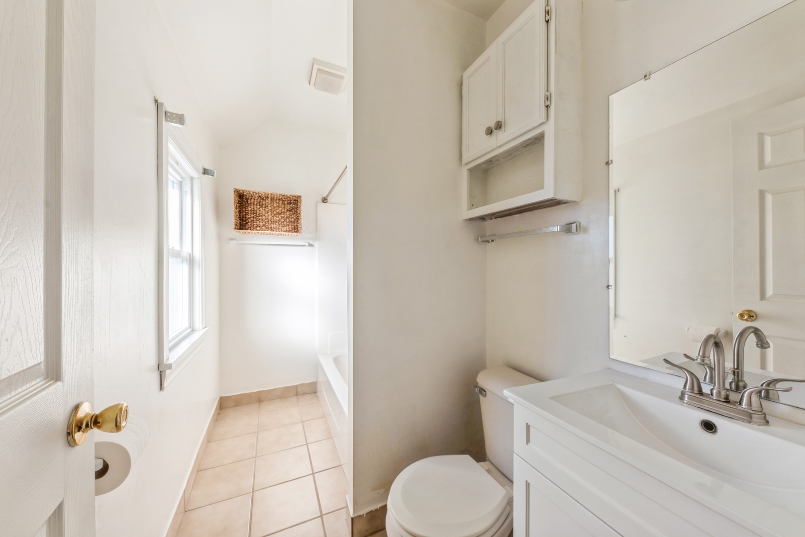 425 East 9th Street, Unit 2 Lockport, IL 60441 - Photo 4 of 7 a bathroom with a sink a toilet and shower