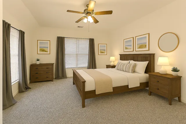 a bedroom with a bed dresser and a window