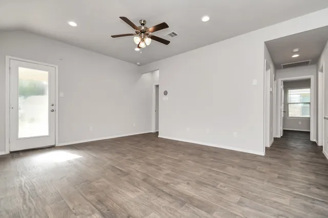 a view of kitchen with stainless steel appliances refrigerator oven and microwave