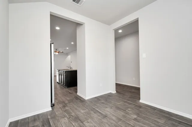 a kitchen with stainless steel appliances granite countertop a sink stove and cabinets